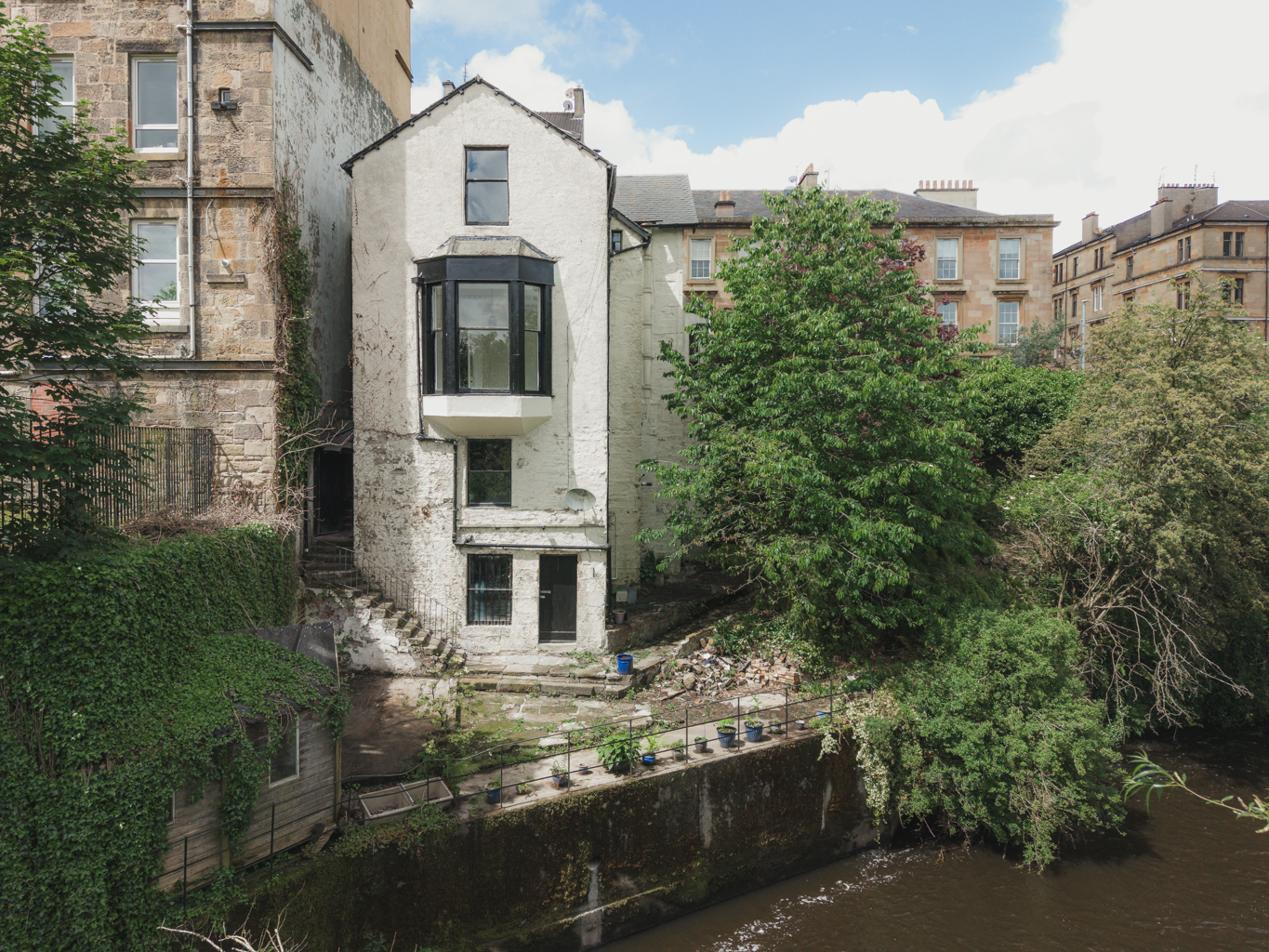 Janefield Cottage, a historic Category B listed cottage orné on the banks of the River Kelvin in Hillhead, Glasgow's West End.