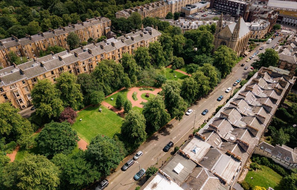 Drone view of Huntly pleasure gardens surrounded by Victorian sandstone terraces in Glasgow’s West End